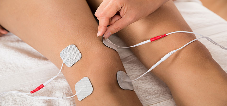 patient receiving Electrical Stimulation Therapy as part of the neuropathy treatment protocol at Smith Family Chiropractic Wellness Center in Campbell